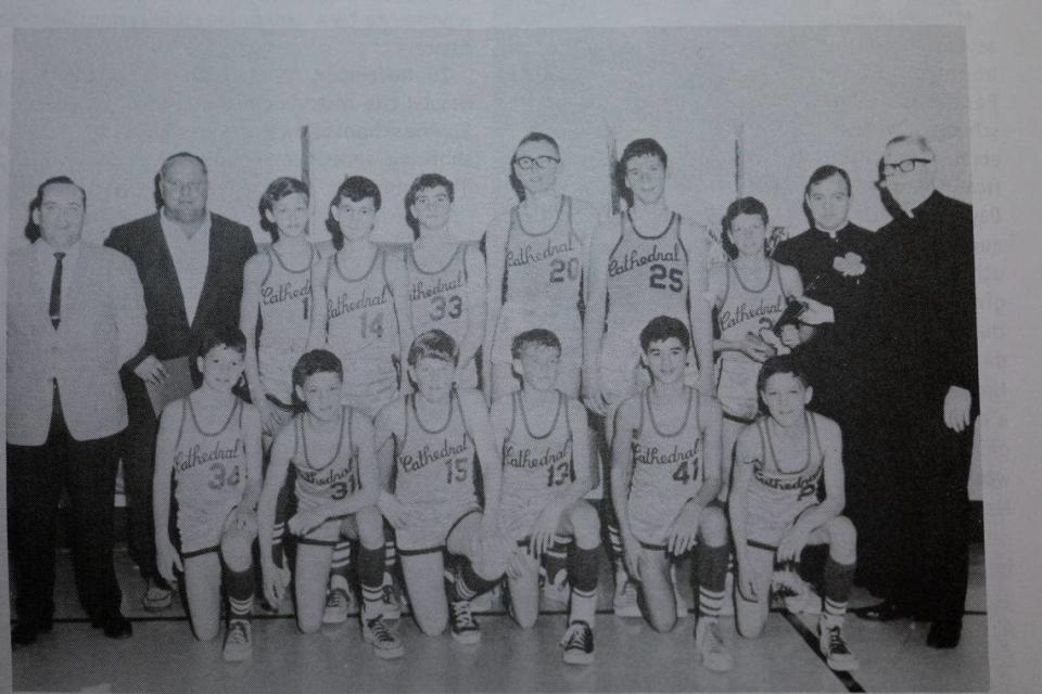 Basketball players and coaches line up for a team photo at Cathedral Grade School in Belleville in the 1960s.