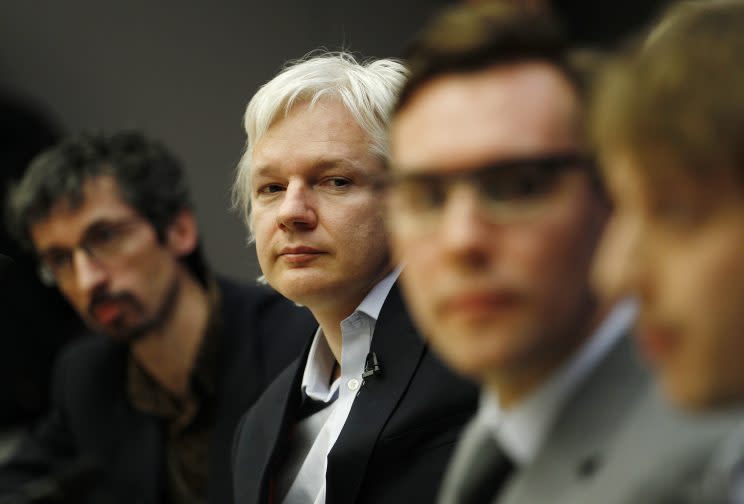 Founder of whistle-blowing website Wikileaks Julian Assange listens during a news conference alongside (L) Jean Marc Manach of OWNI and an (3L) Jacob Appelbaum an independent security expert at the City University in London December 1, 2011. (Photo: Luke MacGregor/Reuters)