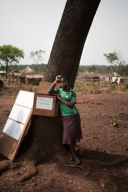 A woman waits for UN aid at the Obo refugee camp