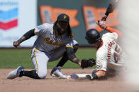 Pittsburgh Pirates shortstop Oneil Cruz, left, tags out San Francisco Giants' Tyler Fitzgerald, right, at second for a double play during the fifth inning of a baseball game Sunday, April 28, 2024, in San Francisco. (AP Photo/Godofredo A. Vásquez)