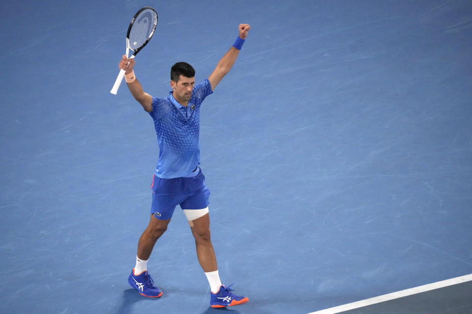 Novak Djokovic of Serbia reacts after defeating Grigor Dimitrov of Bulgaria in their third round match at the Australian Open tennis championship in Melbourne, Australia, Saturday, Jan. 21, 2023. (AP Photo/Dita Alangkara)