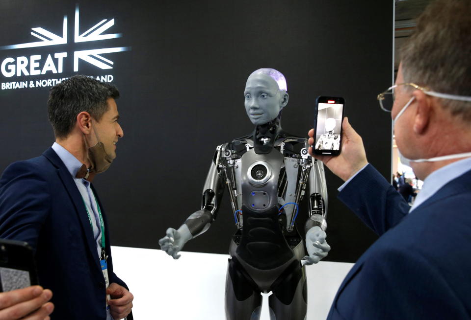 UK tech Ameca, a humanoid robot by Engineered Arts, interacts with attendees at the entrance to the UK Pavilion during CES 2022 in Las Vegas, Nevada, U.S. January 6, 2022. REUTERS/Steve Marcus