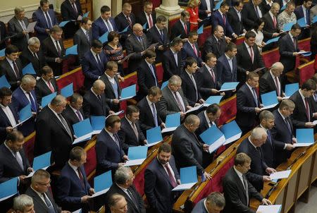 Newly elected parliamentary deputies take their oath during the first session of the new Ukrainian parliament, which was elected in October, in Kiev November 27, 2014. REUTERS/Gleb Garanich