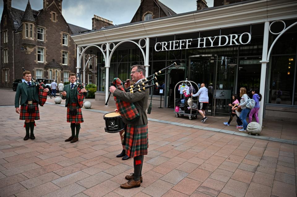 Bagpipe players celebrate the reopening of hospitality venues in Scotland this week (Getty Images)