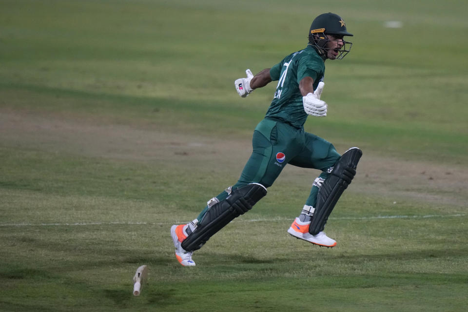 Pakistan's Naseem Shah runs to celebrate after hitting two consecutive sixes to win the T20 cricket match of Asia Cup against Afghanistan, in Sharjah, United Arab Emirates, Wednesday, Sept. 7, 2022. (AP Photo/Anjum Naveed)