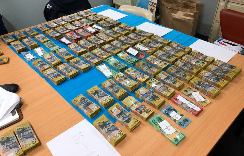 A man has been charged after almost $1 million in cash was allegedly found concealed in a rental car in outback New South Wales. 