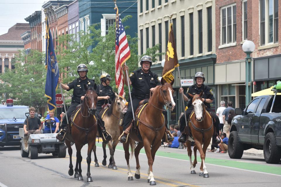 Members of the Lenawee County Sheriff's Office Mounted Division are pictured July 24, 2022, during the Lenawee County Fair parade in Adrian.