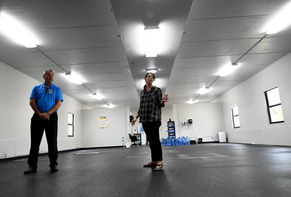 Manatee County Commissioner Amanda Ballard gives a tour of a county building that will be revamped to provide transitional housing for up to 30 families on Wednesday, Oct. 11, 2023.