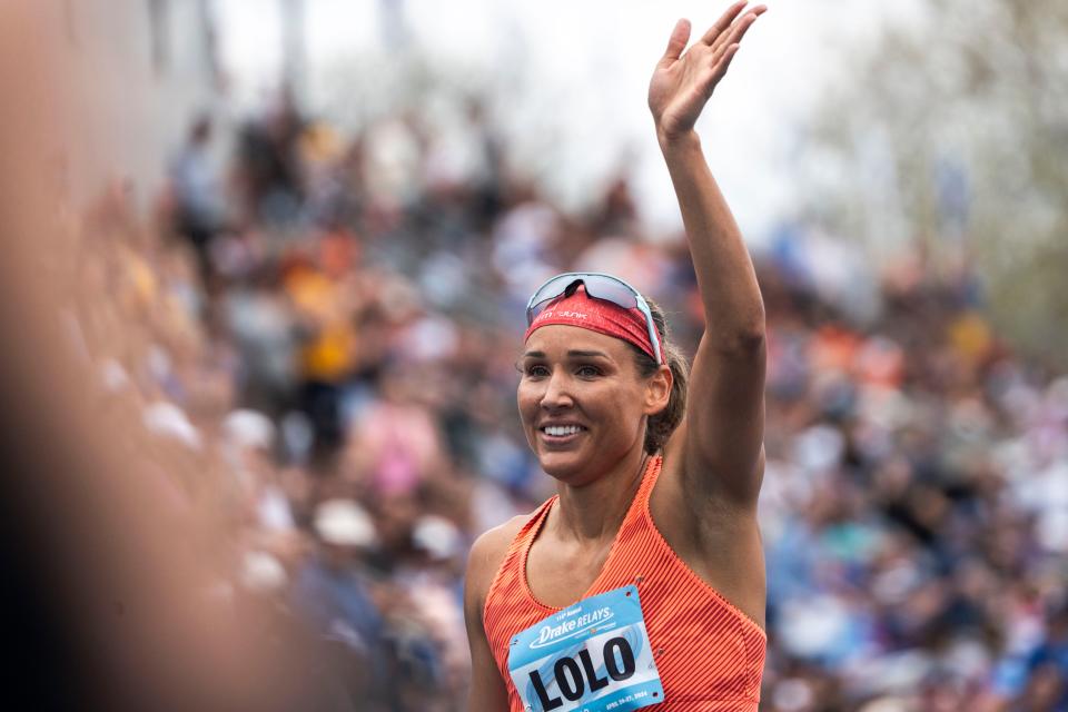 Lolo Jones waves to the crowd after the World Athletic Continental Tour 100 meter hurdle race during the Drake Relays at Drake Stadium on Saturday.