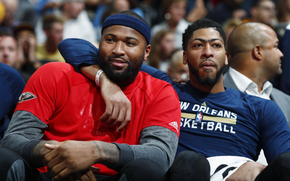 DeMarcus Cousins, left, and Anthony Davis have put up numbers but not wins. (AP)