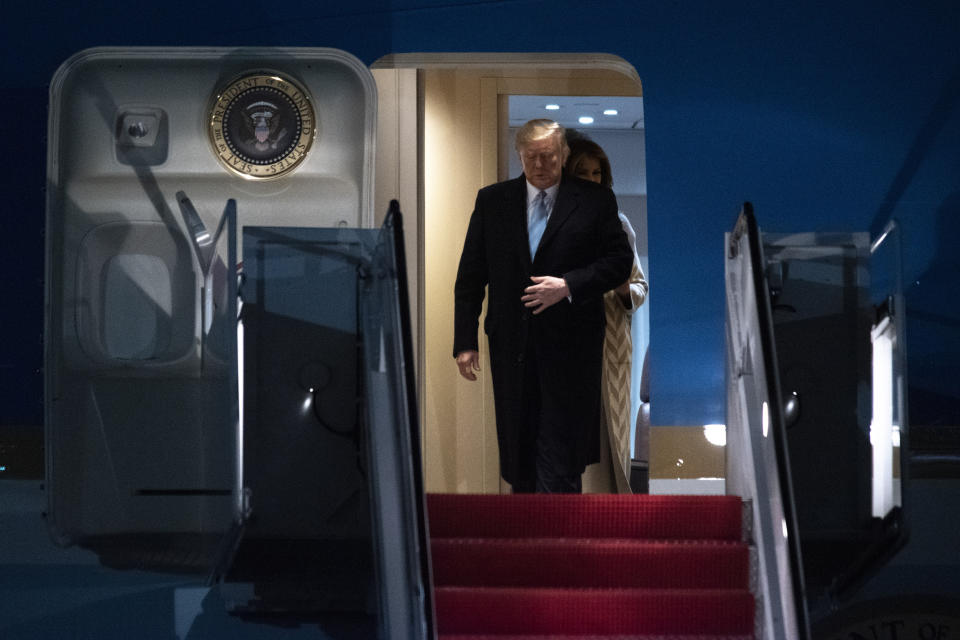 President Donald Trump and first lady Melania Trump exit Air Force One, Sunday, Jan. 5, 2020, at Andrews Air Force Base, Md., following a trip to his Mar-a-Lago estate. (AP Photo/Kevin Wolf)