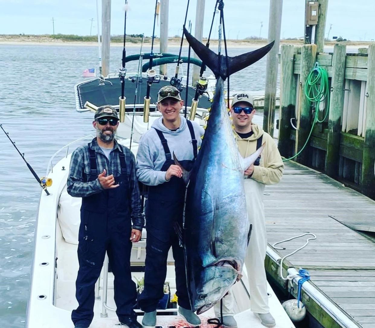 F. J. Lentile, Michael Nolan and Robert Skudera with their catch of a giant bluefin tuna on April 28.