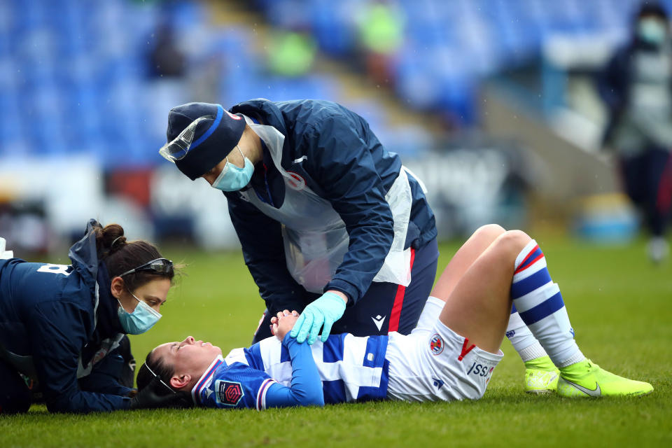 <p>READING, ENGLAND - FEBRUARY 14: Deanna Cooper of Reading Women is treated for injury during the Barclays FA Women's Super League match between Reading Women and Everton Women at Madejski Stadium on February 14, 2021 in Reading, England. Sporting stadiums around the UK remain under strict restrictions due to the Coronavirus Pandemic as Government social distancing laws prohibit fans inside venues resulting in games being played behind closed doors. (Photo by Marc Atkins/Getty Images)</p>
