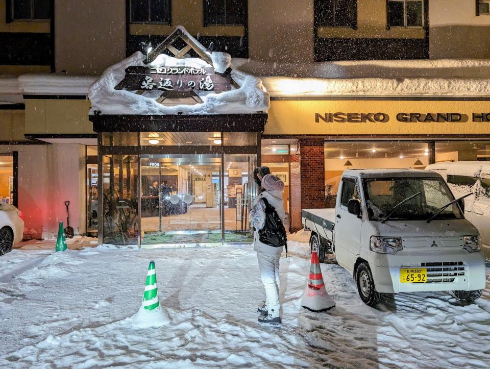 Snow covered parking lot outside an onsen, Japanese bath, in Japan.