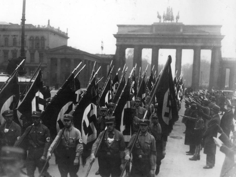 Members of the Nazi party parade through Berlin, Germany.