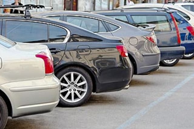 BMGJMT Several cars parked in a parking lot. Image shot 2009. Exact date unknown.