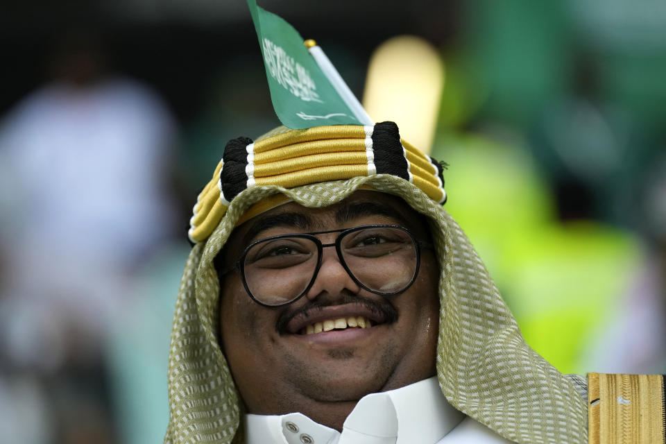 A Saudi Arabia fan cheers prior of the World Cup group C soccer match between Poland and Saudi Arabia, at the Education City Stadium in Al Rayyan , Qatar, Saturday, Nov. 26, 2022. (AP Photo/Francisco Seco)