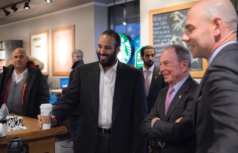 Crown Prince of Saudi Arabia Mohammed bin Salman Al Saud (L) meets with Bloomberg founder and former NYC Mayor Michael A. Bloomberg (2nd R) at a cafe in New York, United States on March 29, 2018.