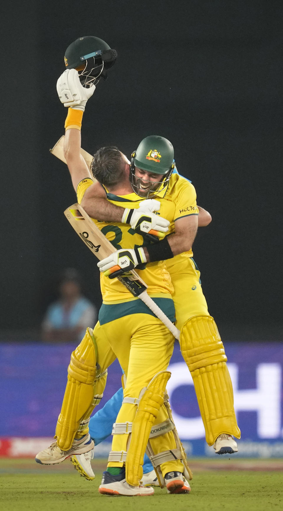 Australia's Glenn Maxwell, facing the camera and teammate Marnus Labuschagne celebrate after Australia won the ICC Men's Cricket World Cup final match against India in Ahmedabad, India, Sunday, Nov. 19, 2023. (AP Photo/Rafiq Maqbool)