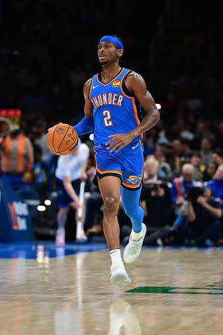 <p>Joshua Gateley/Getty </p> Shai Gilgeous-Alexander #2 of the Oklahoma City Thunder brings the ball down the floor during the second half against the Los Angeles Lakers at Paycom Center on November 30, 2023