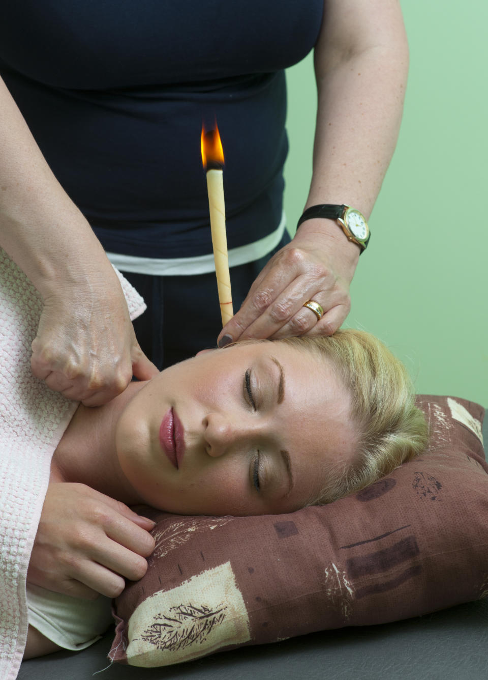 Be cautious when ear candling: the practice can result in burns from the flame and candle wax can drip into the ear, clogging the canal and making you lose hearing for a while. (Getty Images) 