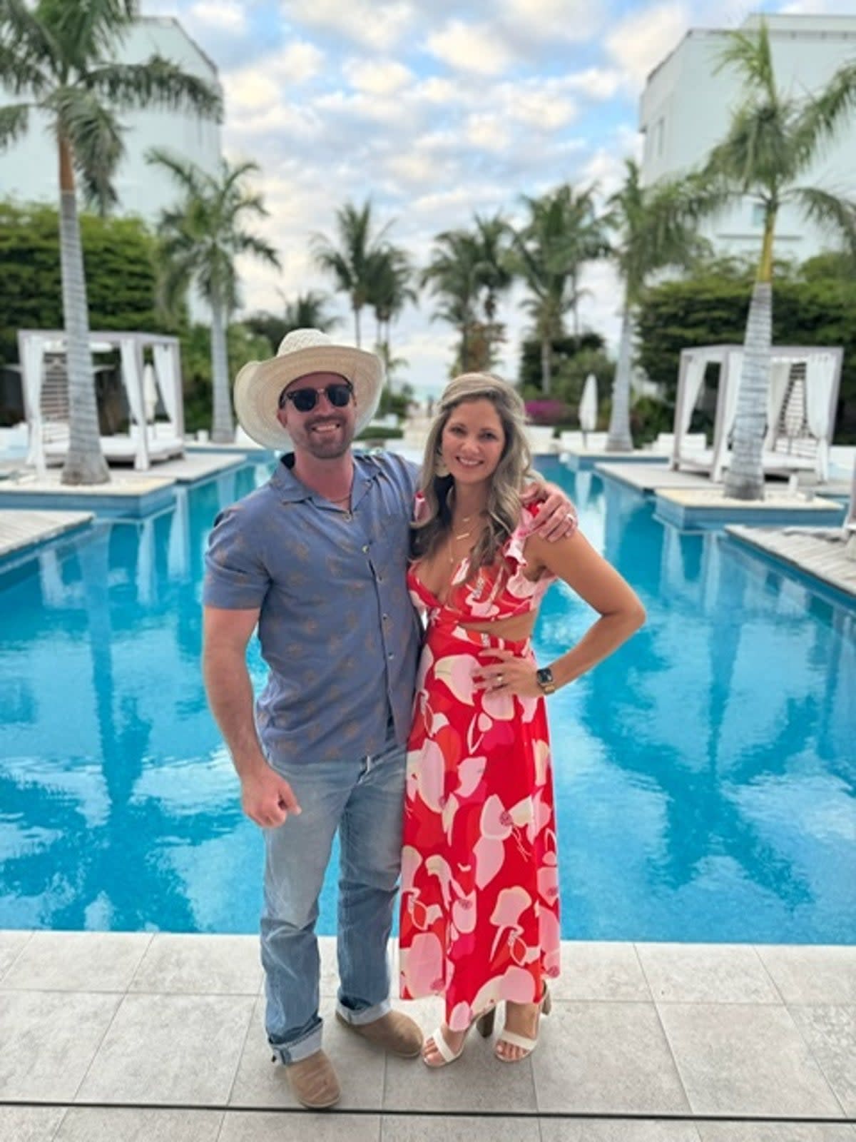 Ryan and Valerie Watson, pictured in Turks and Caicos,  were returning home from vacation in April when they were arrested after airport security found four rounds of hunting ammunition in Mr Watson’s carry-on luggage  (Valerie Watson)