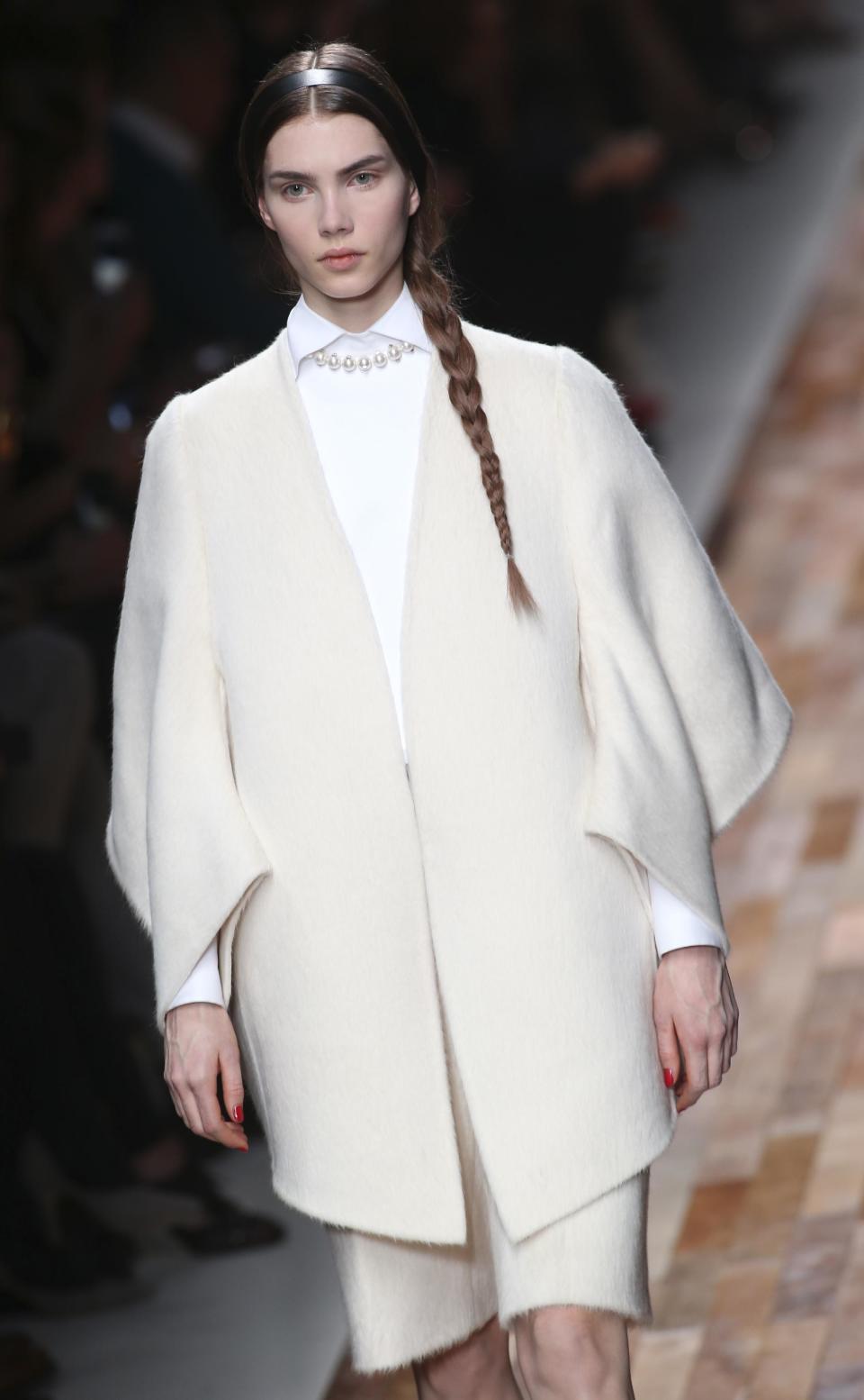 A model wears a creation by fashion designers Maria Grazia Chiuri and Pier Paolo Piccioli for Valentino's Ready to Wear's Fall-Winter 2013-2014 fashion collection, presented, Tuesday, March 5, 2013 in Paris. (AP Photo/Thibault Camus)