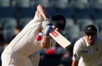 New Zealand's Ross Taylor (R) watches as Australia's Shaun Marsh hits a boundary during the third day of the third cricket test match at the Adelaide Oval, in South Australia, November 29, 2015. REUTERS/David Gray