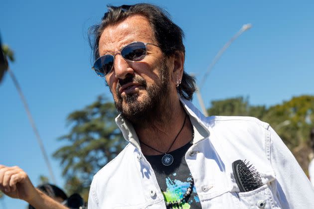 Ringo Starr, pictured in July, is recovering at home, according to a statement. (Photo: VALERIE MACON via Getty Images)