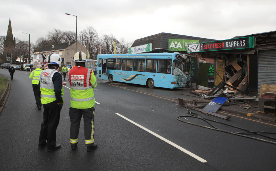 The scene in Handsworth Road, Sheffield, where a school bus crashed into the front of a barbers shop. (PA)