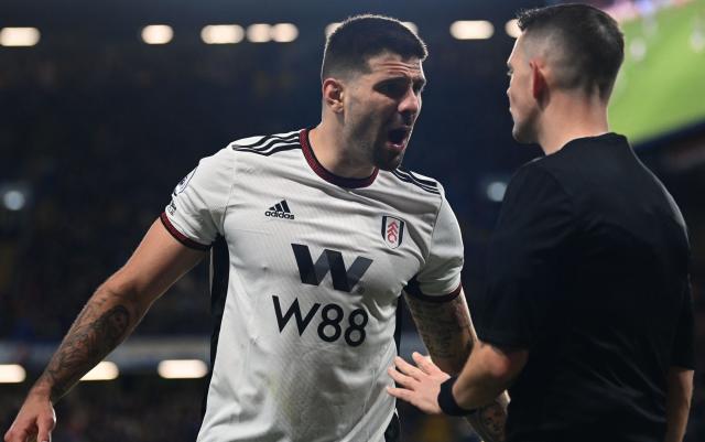 Fulham's Serbian striker Aleksandar Mitrovic argues with the linesman during the English Premier League football match between Chelsea and Fulham - GLYN KIRK/AFP via Getty Images