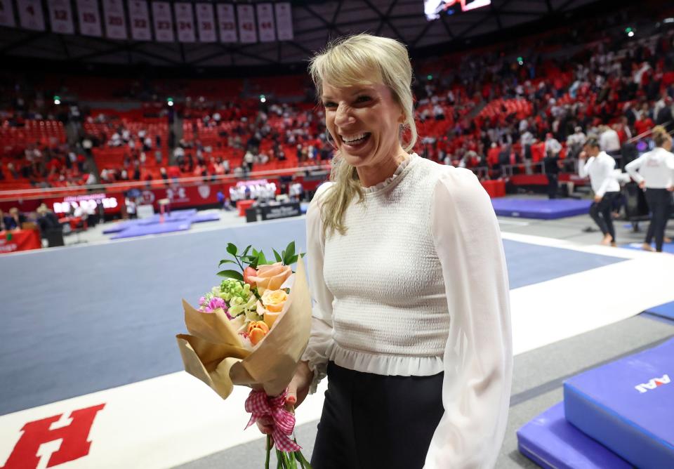 Utah Red Rocks head coach Carly Dockendorf carries flowers after coaching her first gymnastics meet at the Huntsman Center in Salt Lake City on Friday, Jan. 5, 2024. Utah won against Boise State. | Kristin Murphy, Deseret News