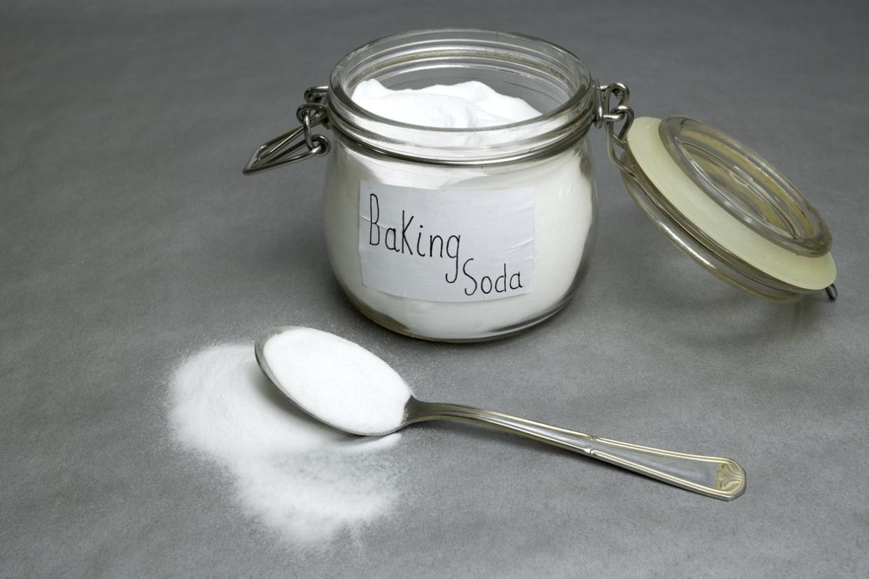 Baking soda isolated on gray background