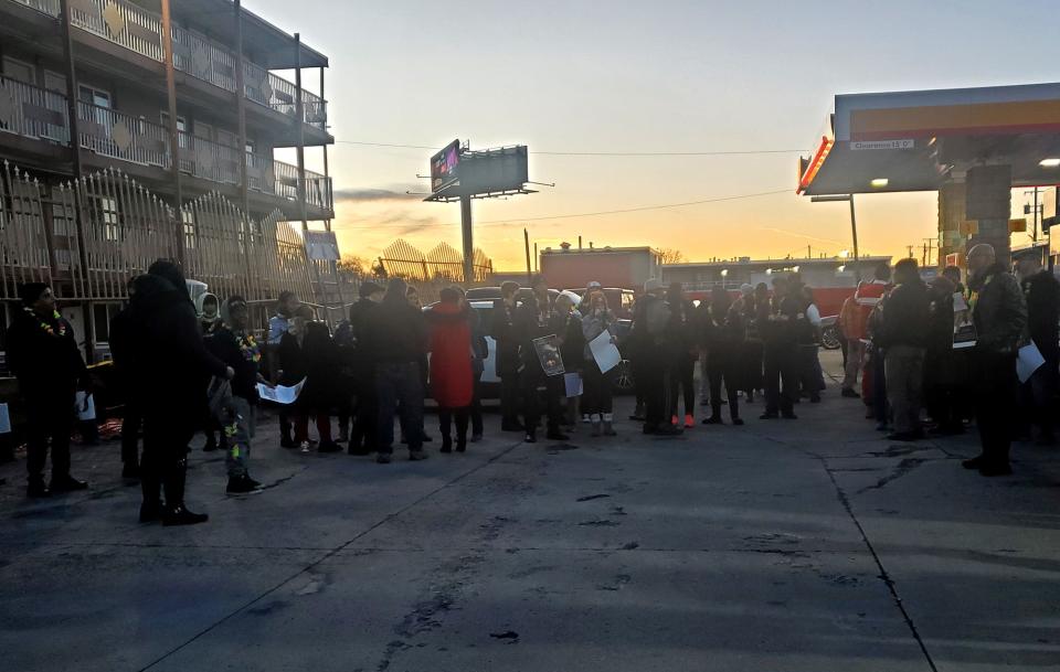 Attendees gather to honor the life of Daniel Jones at an 8 Mile and Greenfield Roads Shell gas station Saturday evening. 