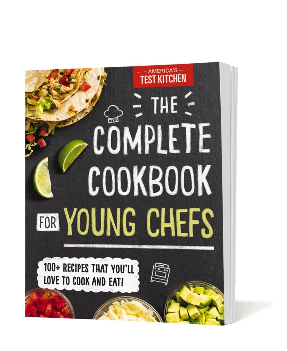 This image provided by America's Test Kitchen in March 2019 shows the cover for "The Complete Cookbook for Young Chefs." It includes a recipe for Roasted Zucchini Noodles. (America's Test Kitchen via AP)