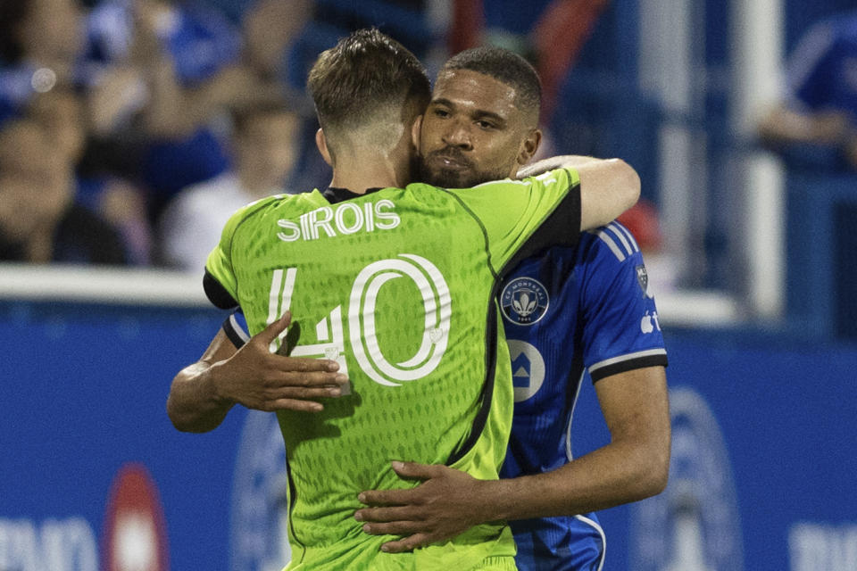 CF Montreal goalkeeper Jonathan Sirois (40) and defender George Campbell celebrate after their win over Minnesota United in MLS soccer match action in Montreal, Saturday, June 10, 2023. (Evan Buhler/The Canadian Press via AP)