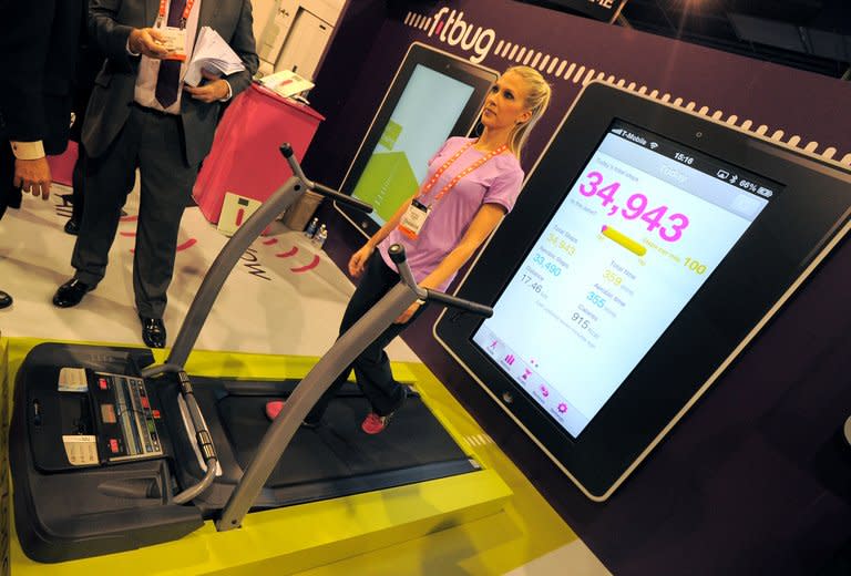 An instructor uses The Fitbug pedometer - a system uplinked to a web site to track your walking steps, distance, diet and fitness activities, at the Las Vegas Convention Center, on January 9, 2013, in Las Vegas, Nevada. CES, the world's largest annual consumer technology trade show, runs from January 8-11 and is expected to feature 3,100 exhibitors showing off their latest products and services