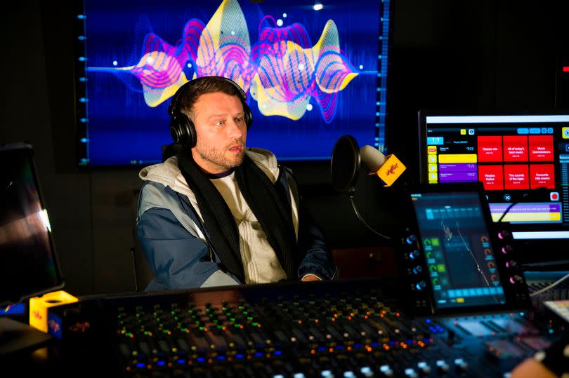 Paul takes part in a radio interview -Credit:ITV