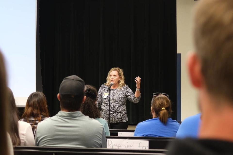 Palma Sola Elementary School principal Jennifer Grimes addresses hundreds of community members at a meeting to address rumors about the school potentially closing.