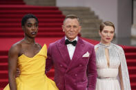 Lashana Lynch, from left, Daniel Craig and Lea Seydoux pose for photographers upon arrival for the World premiere of the new film from the James Bond franchise 'No Time To Die', in London Tuesday, Sept. 28, 2021. (AP Photo/Matt Dunham)