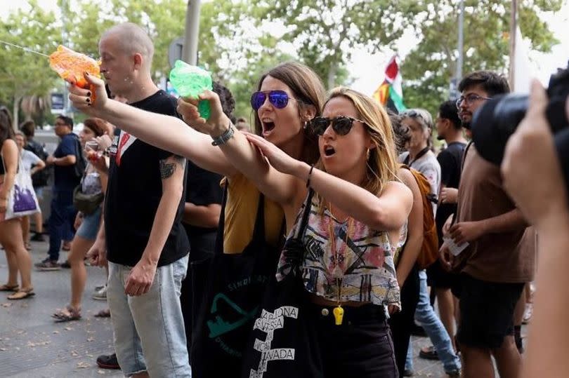 Protests happened in Barcelona where people took to the streets armed with water pistols to spray tourists