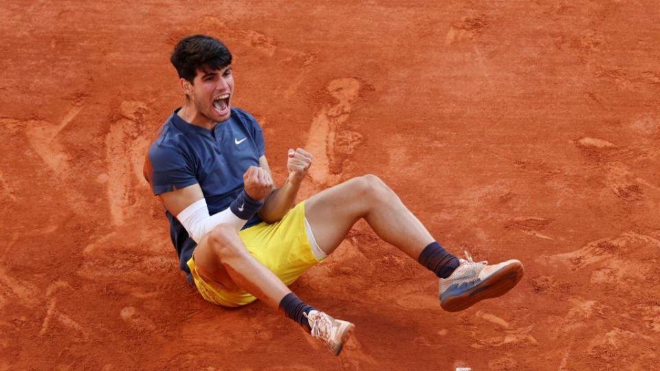 Carlos Alcaraz celebrates after winning the French Open