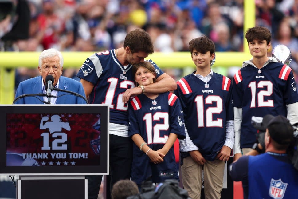 Former quarterback Tom Brady embraces his daughter while being honored by the New England Patriots at halftime of an NFL football game between the New England Patriots and the Philadelphia Eagles at Gillette Stadium on September 10, 2023 in Foxborough, Massachusetts.