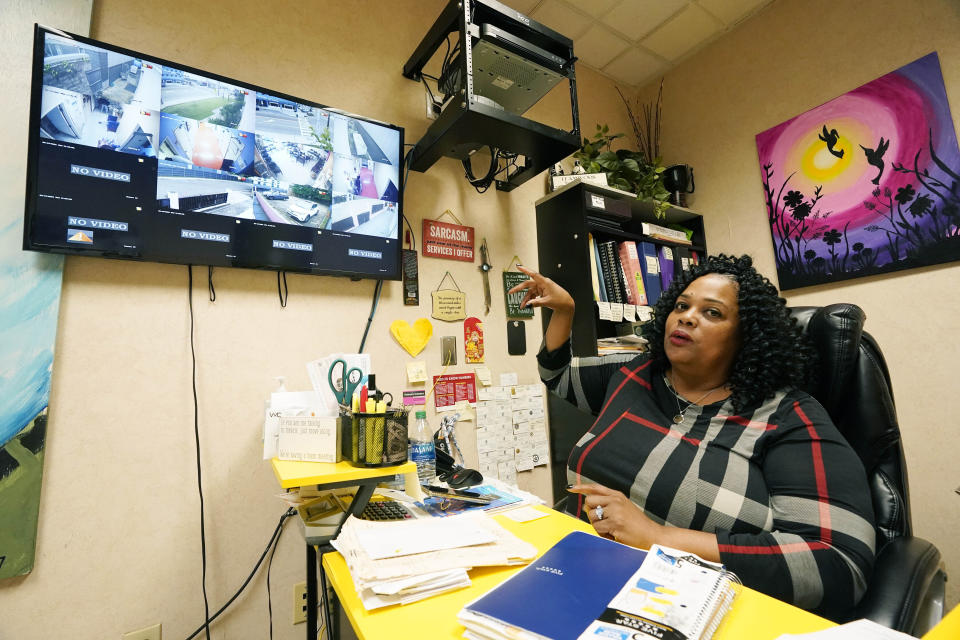 Jackson Women's Health Organization clinic director Shannon Brewer, sits under a monitor that shows all areas of the medical facility, both inside and out, Wednesday, May 19, 2021, in Jackson, Miss. Brewer expressed her concern for patients in light of the U.S. Supreme Court considering arguments later this year over a Mississippi law that would ban most abortions after 15 weeks. (AP Photo/Rogelio V. Solis)