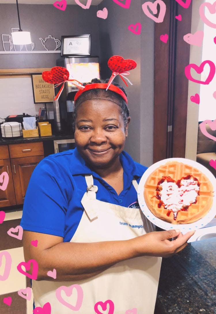 Regina Triche shows off one of her many waffle variations on National Waffle Day.