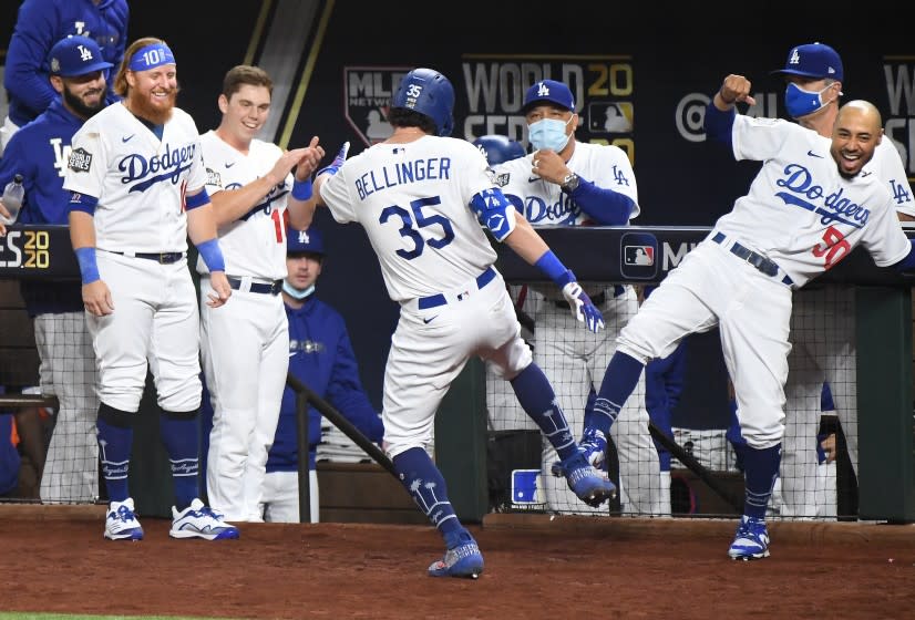 ARLINGTON, TEXAS OCTOBER 20, 2020-The Dodgers dugout celebrates Cody Bellinger's two-run home run against the Rays in the 4th inning in Game 1 of the World Series at Globe Life Field in Arlington, Texas Tuesday. (Wally Skalij/Los Angeles Times)