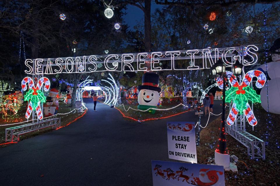 A "Seasons Greetings" welcomes visitors to Doug and Jane Alred's home in Jacksonville's Beauclerc neighborhood.