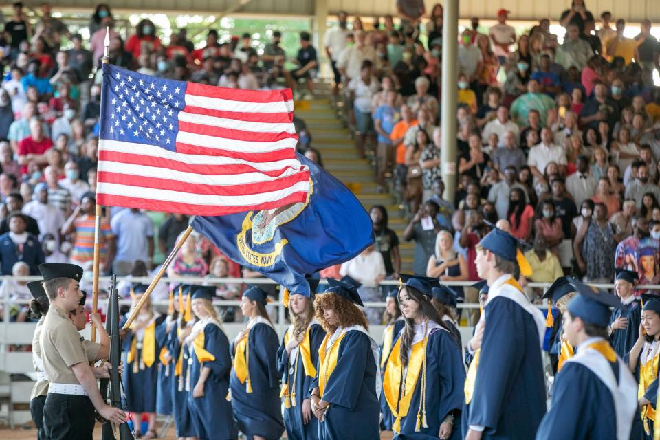 The American Flag flies over the graduates during Vanguard High School’s 51st graduation at the Southeastern Livestock Pavilion in Ocala, Florida last year.