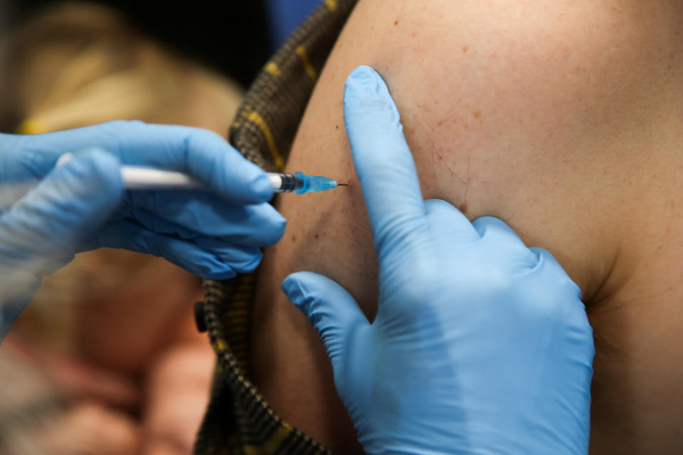 A NHS staff administers a dose of Pfizer, coronavirus (Covid-19) vaccine to a patient at a vaccination centre in London. (Photo by Dinendra Haria / SOPA Images/Sipa USA)