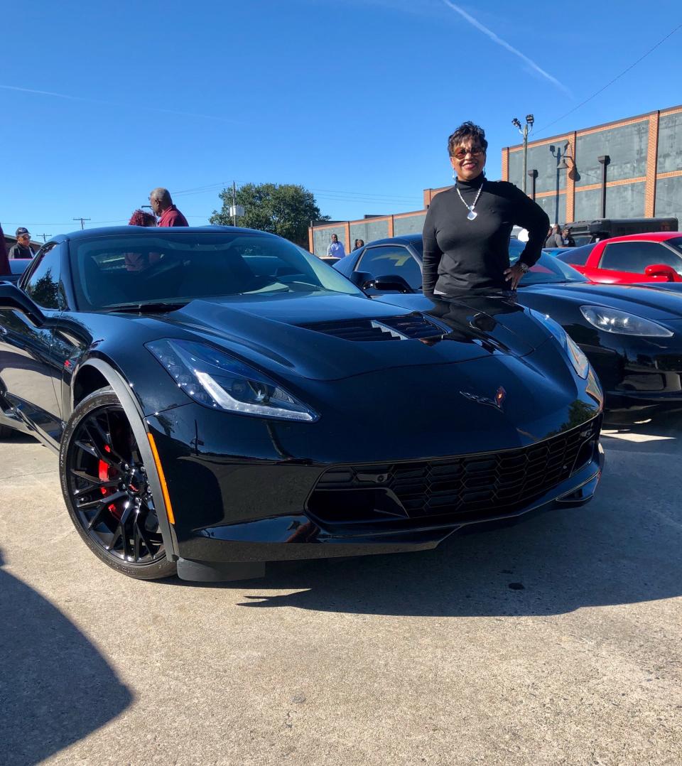 Vanessa Bishop stands next to her 2019 Corvette Z06 at a Corvette club car show in Savannah, Georgia, Nov. 2, 2019.